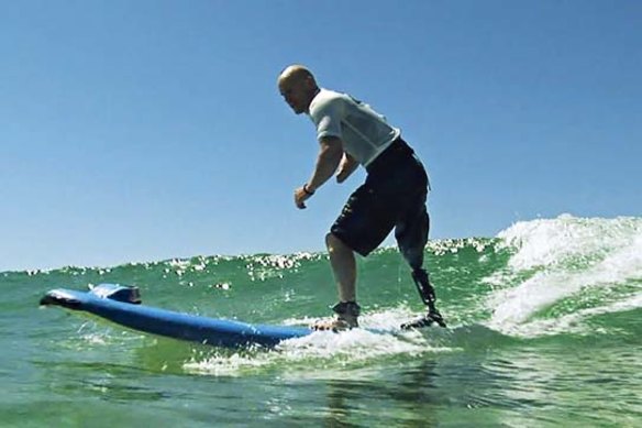 Swell time... shark attack victim Paul de Gelder hits the waves.