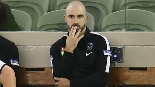 Steele Sidebottom of the Magpies looks on from the bench with an injury during the 2021 AAMI Community Series match between the Collingwood Magpies and the Richmond Tigers at Marvel Stadium on March 5, 2021 in Melbourne, Australia. (Photo by Michael Willson/AFL Photos via Getty Images)