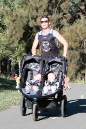 Canberra dad Luke Greenhalgh training with the twins Dahli and India.