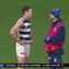 Jeremy Cameron talks to a Geelong official on the ground after suffering a head knock against Port Adelaide.