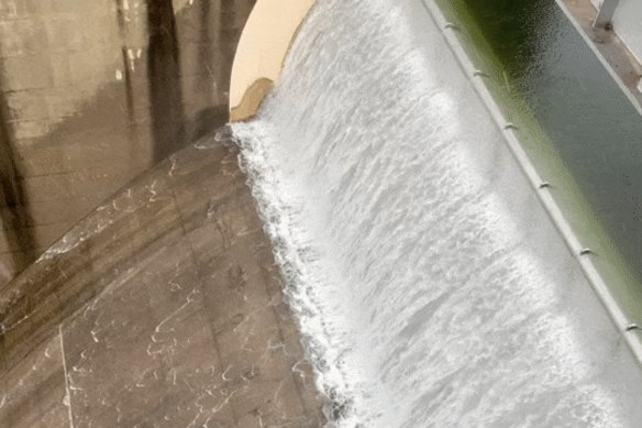 Warragamba Dam spilling during last March’s floods. It was sitting at 96.3 per cent full on Monday, almost the same as a year ago.