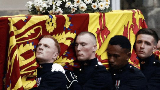 The Queen’s coffin arrives in Edinburgh on September 11 after a six-hour-long journey from Balmoral. Agency images.