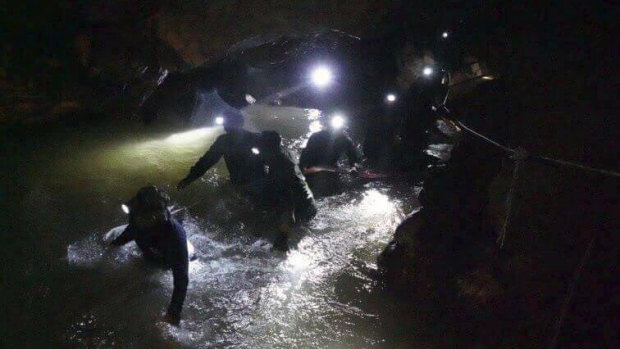Thai rescue teams work to save the 12 boys and their coach from the Tham Luang cave complex.