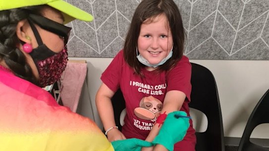 Charlie Murphy, 10, is vaccinated at Chelsea Heights medical centre.