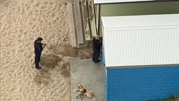 Police say the explosives equipment was found near one of the beach's bathing boxes.