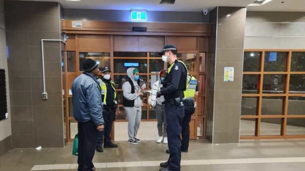 The police presence in one of the locked-down public housing towers on Saturday night. 