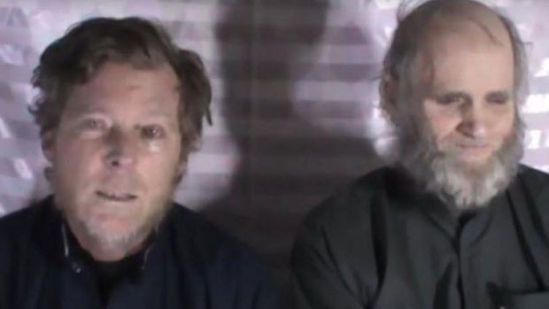 Weeks (left) and his American colleague, Kevin King, appear in a video apparently published by the Taliban in 2017. 