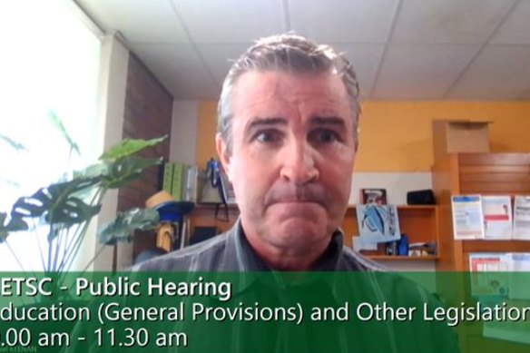 Oakey State High School principal Danny Keenan speaking on behalf of the school’s leadership team via video link during a public hearing of the Education, Employment, Training and Skills Committee.