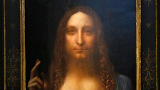 Security guards reveal Salvator Mundi ahead of its sale by Christie's in New York in 2017. 