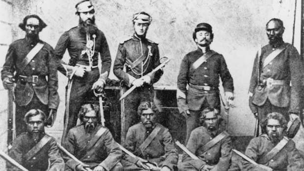 Members of the NMP photographed on 1 December 1864 at Rockhampton. In the back row from left to right are Trooper Carbine, George Murray, an unknown 2nd Lieutenant, an unknown Camp Sergeant and Corporal Michael. In the front row from left to right are Troopers Barney, Hector, Goondallie, Ballantyne and Patrick. 