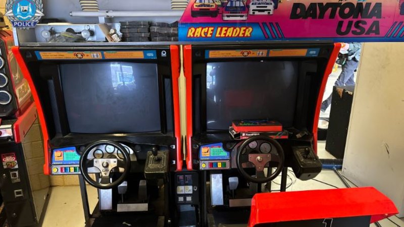 Rebels bikie charged after police find cash and gun hidden in arcade game