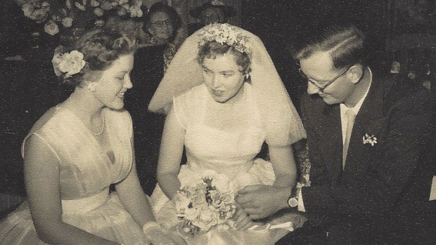 Shirley Stackhouse (centre) on her wedding day with bridesmaid and sister Judith Hobbs (nee Howes) and husband John.
