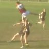 Daniel Wood clutches the ball mid-air.