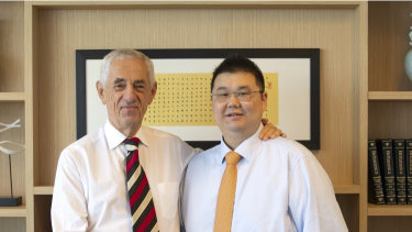 Michael Gu, right, founder of failed property group iProsperity, with Sydney solicitor John Landerer.
