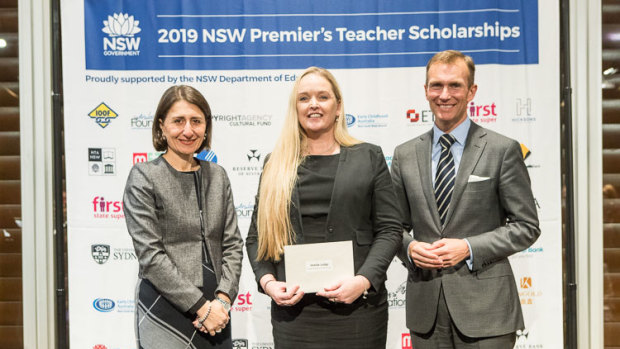 Imelda Judge (centre) receives a 2019 NSW Premier’s Teacher Scholarship from NSW Premier Gladys Berejiklian and NSW Education Minister Rob Stokes.