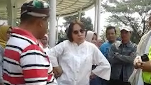 A 52-year-old Indonesian woman, known only as SM, who is facing charges of blasphemy after entering the holy area of the Jam Al Munawaroh mosque.