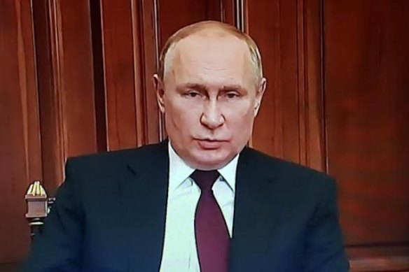 Russian President Vladimir Putin announcing plans to sign a decree on eastern Ukraine regions.