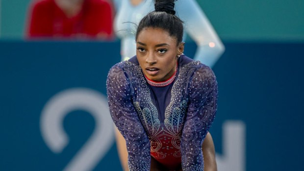 Simone Biles prepares to perform her routine at the Paris 2024 Summer Olympic Games.