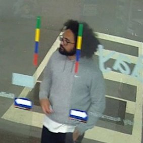 Police have released an image of a man who they believe may have information about the arsons.