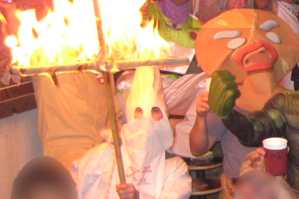 A fancy dress party at the unofficial Australian soldiers’ bar in Afghanistan, where Person 35 dressed as a member of the KKK.