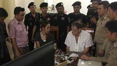 Gary Knowles at his arrest. Cambodian papers said the woman was his girlfriend. 