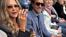 Andrew McLeod at the AFL grand final having a beer.