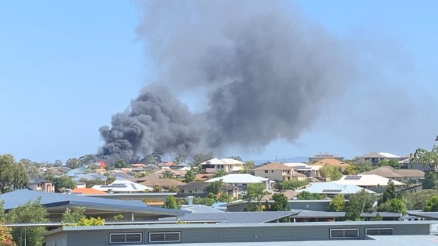 The two-storey house in Mango Hill goes up in flames.