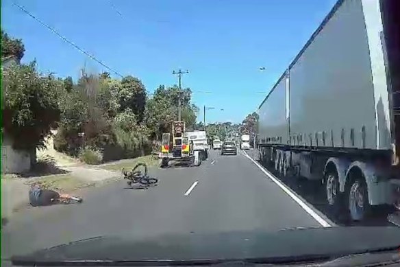 A still from dashcam footage of cyclist Mark Vander being hit by a truck.