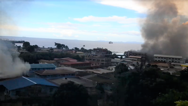 Buildings burn in Honiara’s Chinatown, in the Solomon Islands on Thursday. Screenshot ZFM 99.5