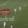 Warriors halfback Tanah Boyd has his field goal attempt charged down.