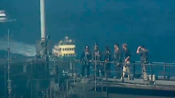 Prince Harry and Scott Morrison wait for the Invictus Games flag to be raised.