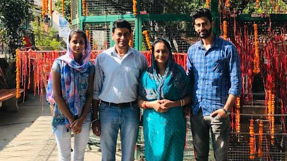 Australian permanent resident Pragya Chandel (second from left), his wife and two adult children were knocked back from the first repatriation flight out of Delhi after three of the four family members tested positive.
