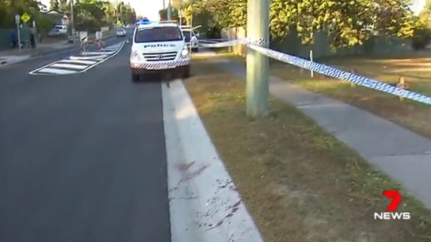 Bloodstains on the road after a man was stabbed in Woodridge.
