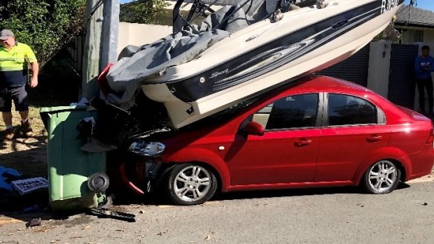 The crash in Palm Beach where a car hit a boat on a trailer parked at the side of the road.