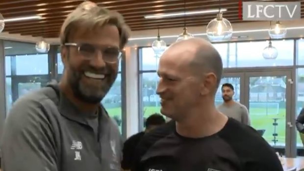 Reds zone: Maguire meets Liverpool manager Jurgen Klopp.
