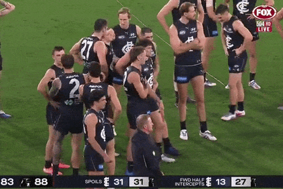 Elijah Hollands’ interaction with Blues coach Michael Voss after the final siren against Collingwood.