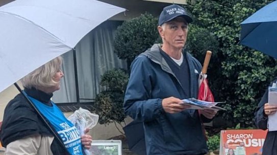 Liberal Vice-President Geoff Pearson handing out for disendorsed candidate Ben Britton on Tuesday. Pearson resigned from the party.