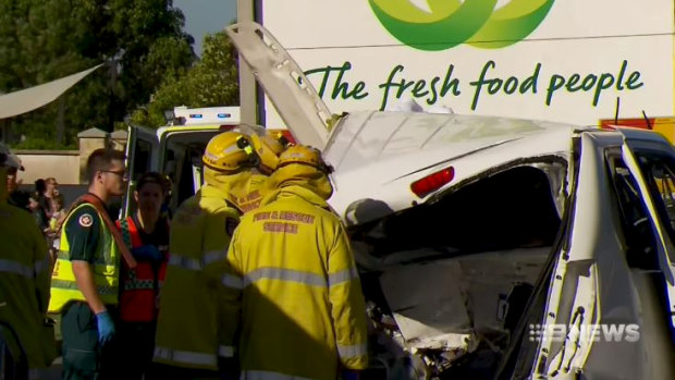 The van was crushed between the ute and a Woolworths truck