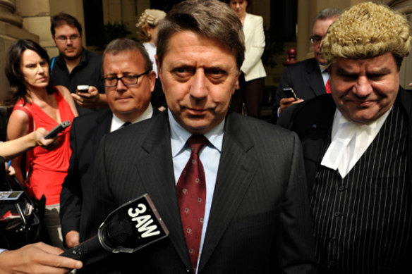 Noel Ashby leaves the Supreme Court after perjury charges against him were dropped in 2010.