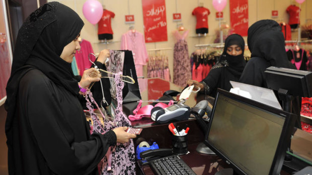 Fully-veiled Saudi women shop at a lingerie store in the Saudi Red Sea port of Jeddah on January 2, 2012. From this week, only female staff will be able to sell women's lingerie in Saudi Arabia, ending decades of awkwardness in the ultra-conservative Muslim kingdom where women are expected to don black cloaks at all times out of the home.
