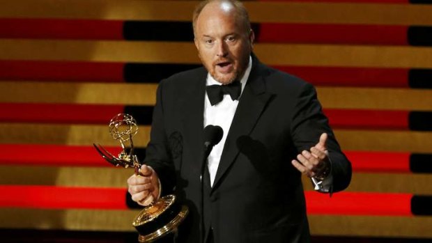 An appreciative Louis C.K. collects the Emmy.