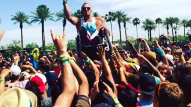 Dylan Alcott crowdsurfs at Coachella music festival.