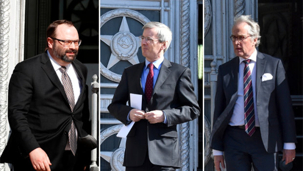 Ambassadors from (L-R) Canada,  Britain and Germany are pictured leaving the Russian Foreign Ministry on Friday after being summoned to hear how many of their staff would be expelled.
