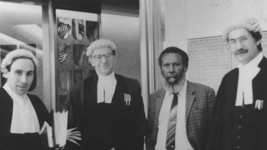 The Mabo case legal team: solicitor Greg McIntyre, barrister Ron Castan, Eddie Koiki Mabo and barrister Bryan Keon-Cohen at the High Court of Australia 1991.  Still from the film Mabo - Life of an Island Man.