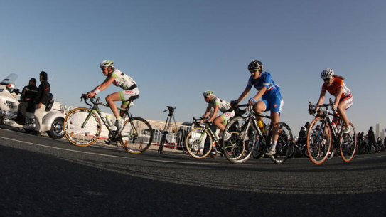 Cyclists compete in the third stage of the Tour of Qatar women's cycling race in Doha on February 3, 2012. The route of the third stage covered 92.5 kms starting from the Katara Cultural Village in Doha. AFP PHOTO/KARIM JAAFAR