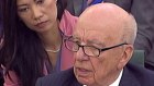 Rupert Murdoch is used to having Wendi Deng in the background. 