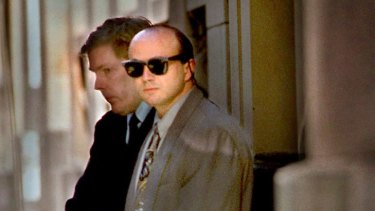 A shackled Christopher Binse leaves the Supreme Court in 2001.