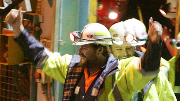 Miners Todd Russell, left, and Brant Webb emerge from the mine.