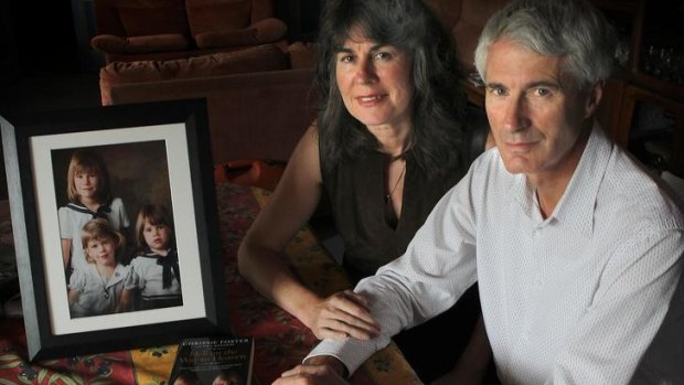Anthony and Christine Foster with a picture of their daughters, two of whom were abused by Father Kevin O'Donnell.