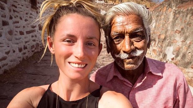 Jolie King snapping a selfie with a man in the city of Jodhpur, India. 